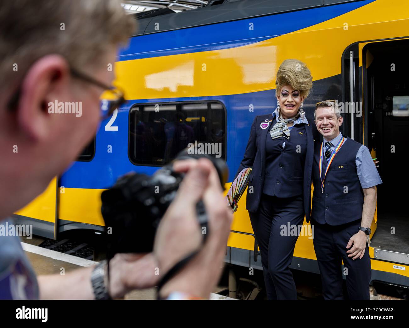 TILBURG - NS personnel pose for a photo as the Pink Monday Express ...
