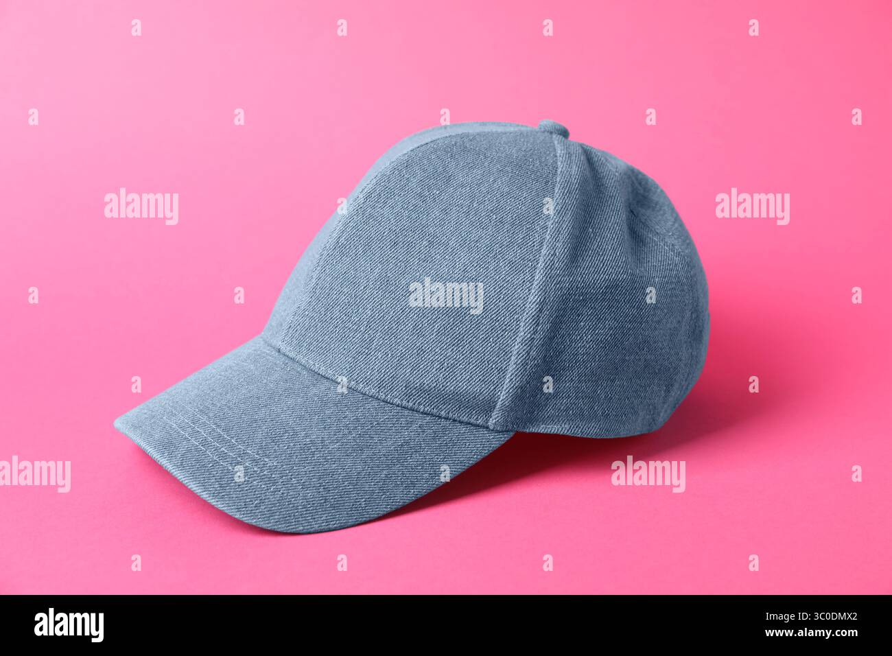 Denim baseball hat on pink background, closeup Stock Photo