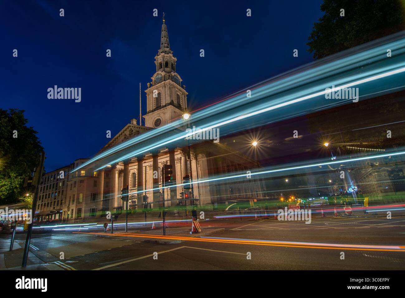 St Martin-in-the-Fields Church at night with light trails,  London, England, UK. A neoclassical building by James Gibbs. Stock Photo
