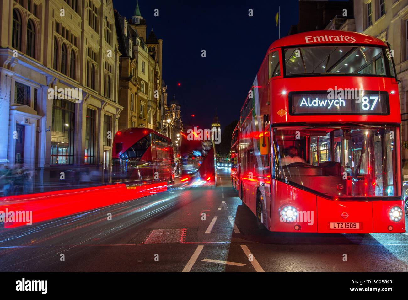 Whitehall with London red Routemaster buses and Big Ben in the distance ...