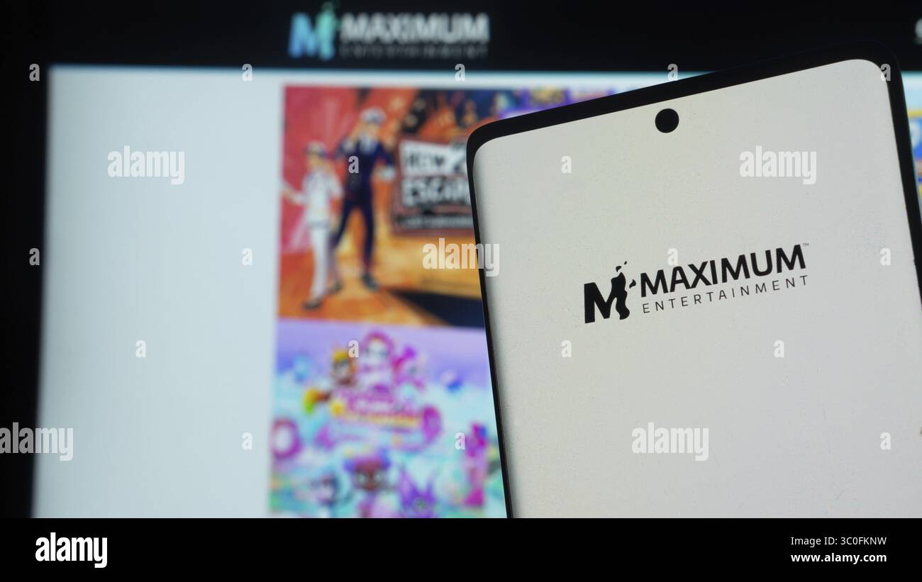 Smartphone displaying Maximum Entertainment logo against colorful ...