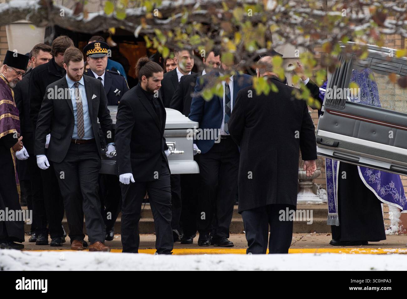 November 26, 2018 - Lansing, IL, USA - Pallbearers carry the casket out of St. Archangel Michael Serbian Orthodox Church in Lansing, Ill., after the funeral service for Mercy Hospital shooting victim Dayna Less on Monday, Nov. 26, 2018. (Credit Image: © Kyle Telechan/Chicago Tribune/TNS via ZUMA Wire) Stock Photo