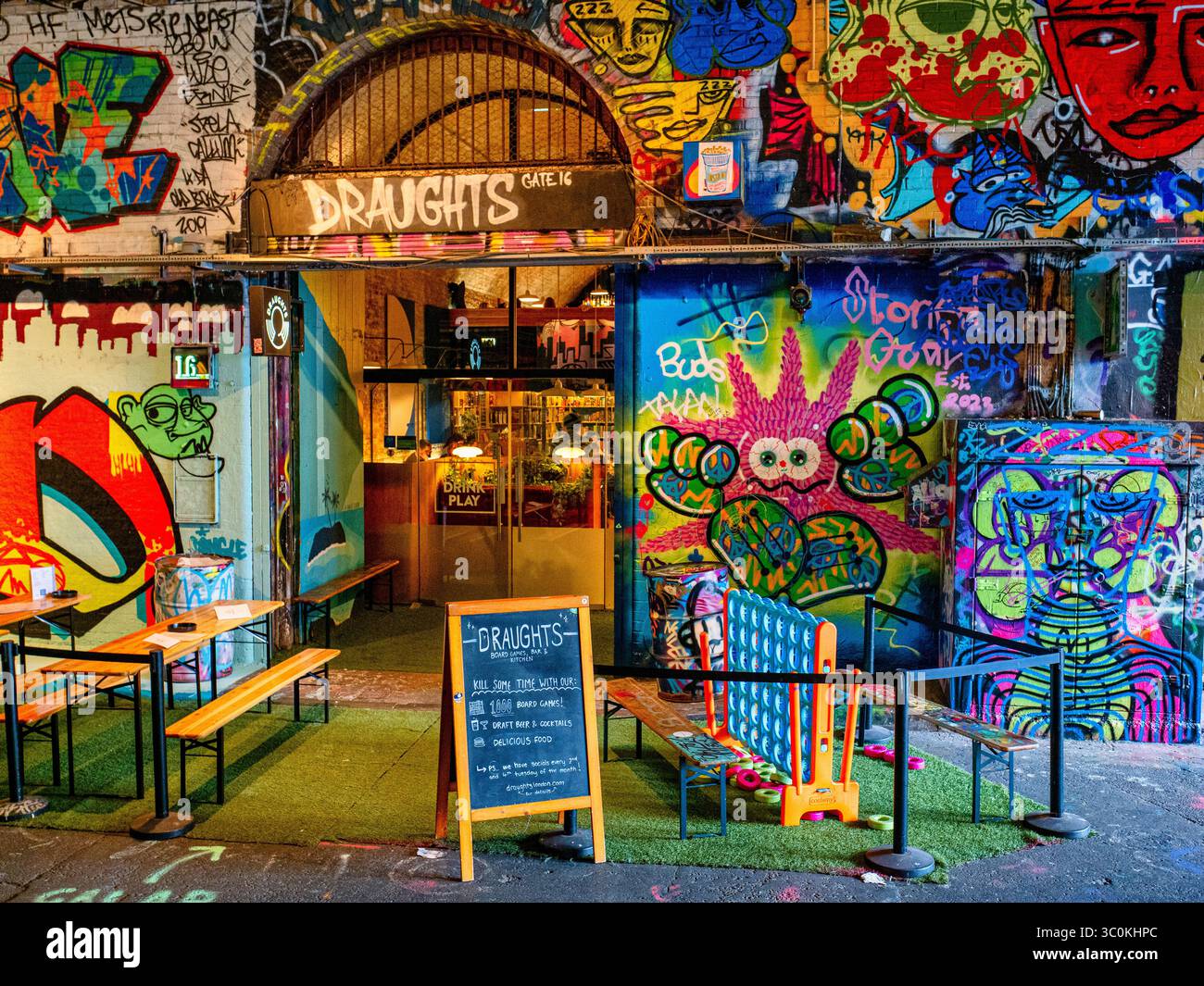 Draughts Bar at Leake Street, also known as Graffiti Tunnel, underneath Waterloo Train Station, Lambeth, London Stock Photo