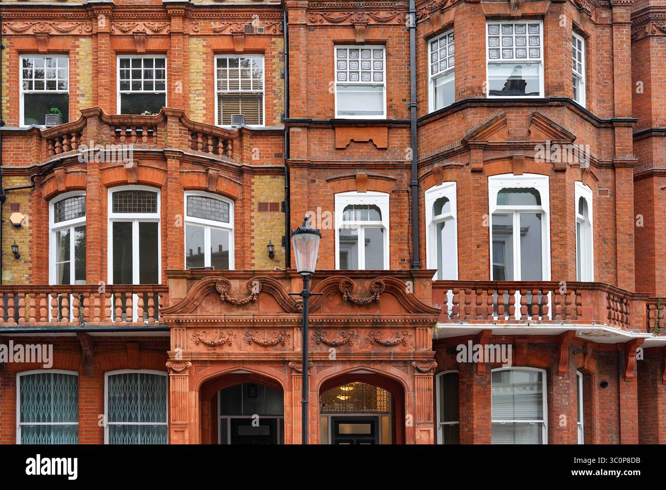 ornate brick apartment buildings with bay windows and in London ...