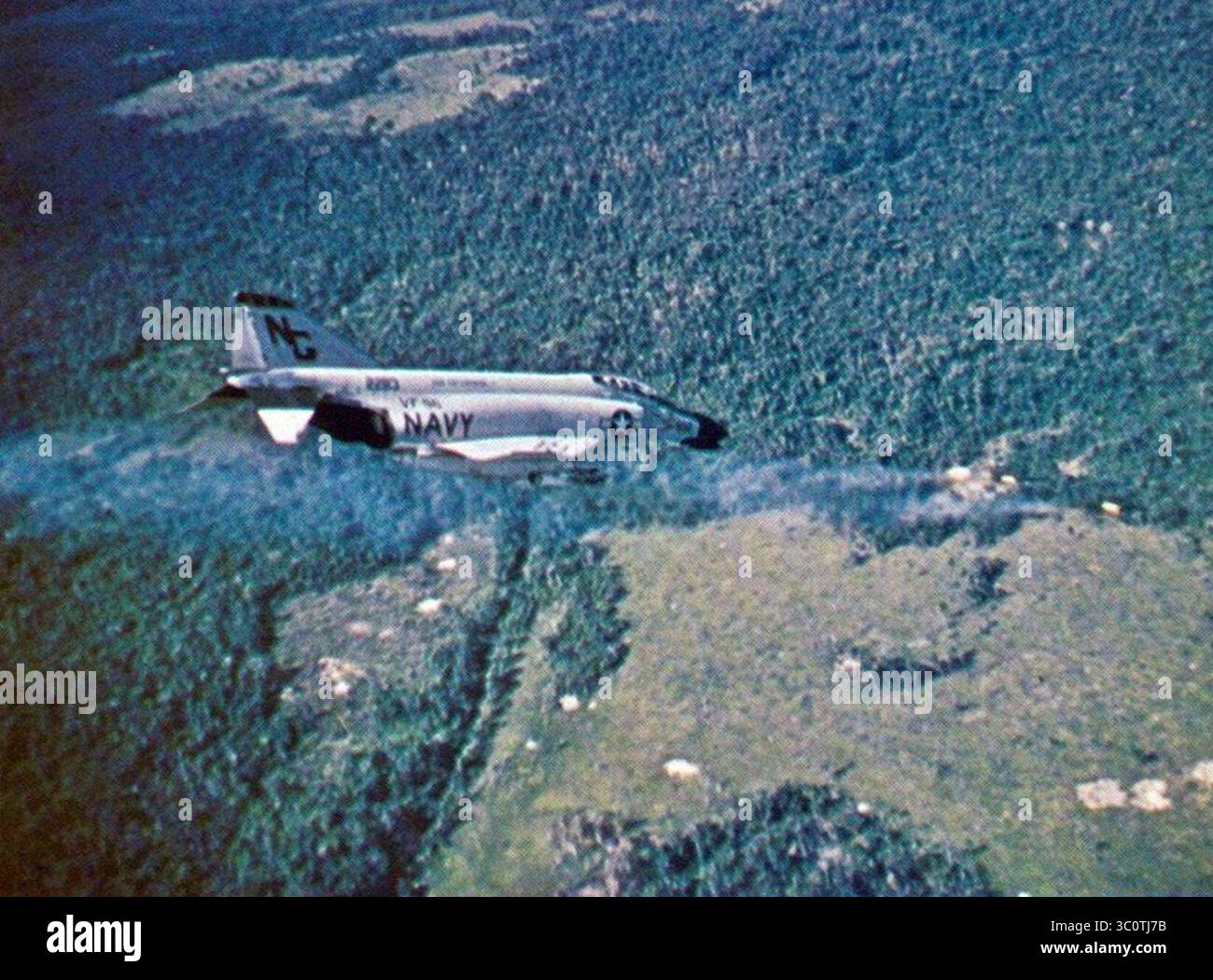 McDonnell F-4B Phantom II of VF-96 firing Zuni rockets at a target in ...