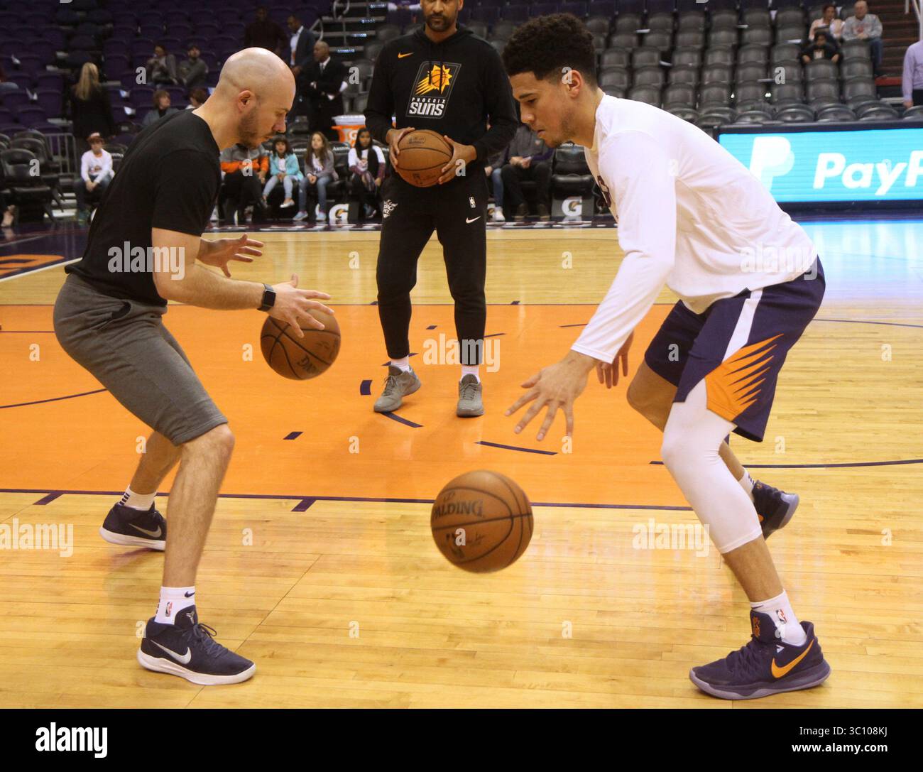 Devin Booker running through drills with his assistant coach