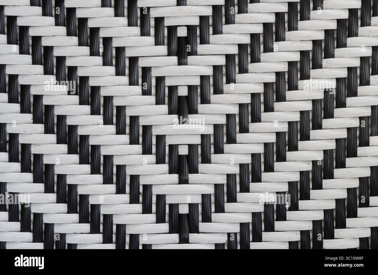 Two-tone black and white abstract weave pattern on plastic rattan ...