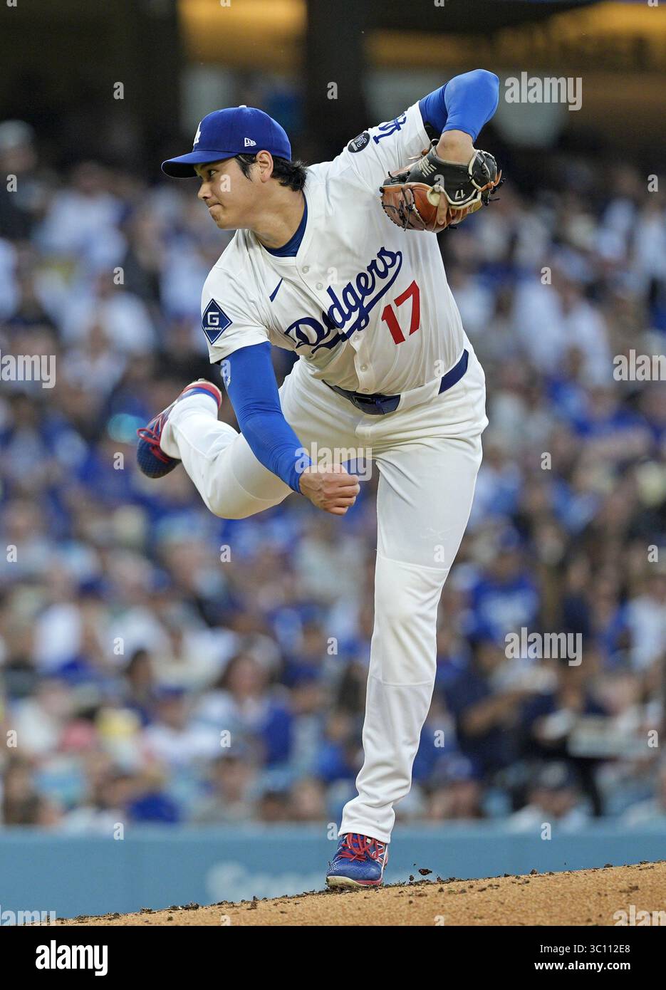 Los Angeles Dodgers two-way player Shohei Ohtani (17) hits a single
