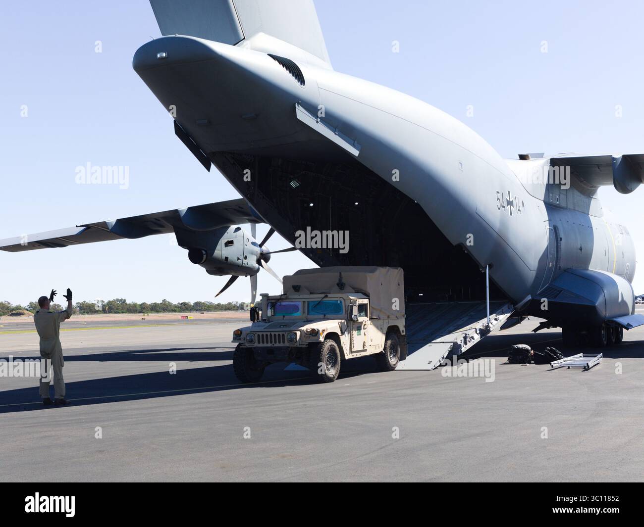 A German air crewman from the German Air Force A400M ground guides a U ...