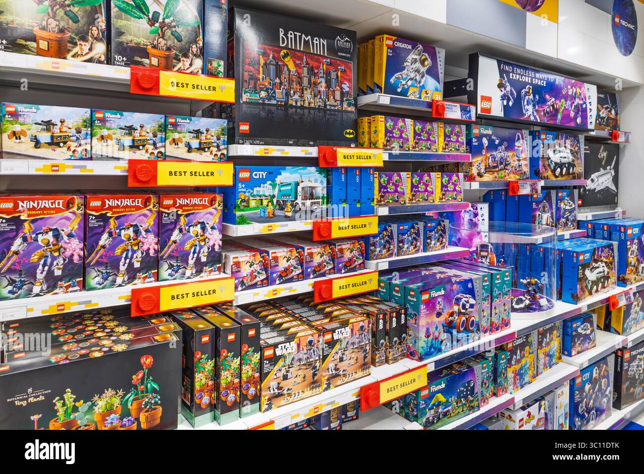 Colorful LEGO toy aisle with stacked building set boxes and price labels. London, UK, 2 June 2024 Stock Photo