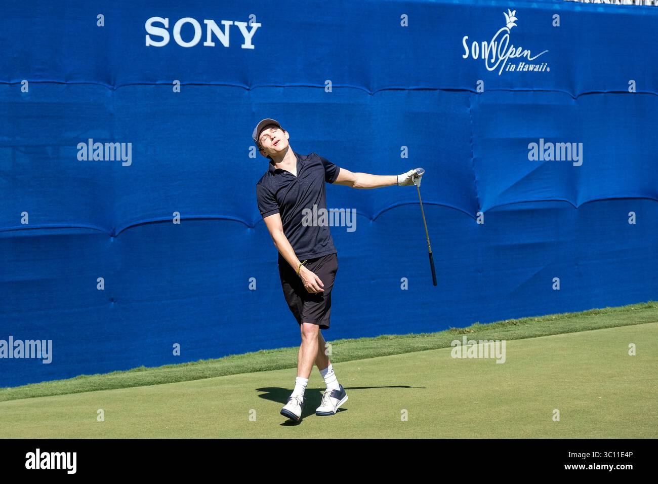 January 9, 2019 - Honolulu, Hawaii: Tom Holland who plays the role of Spider Man in the Avengers movie reacts to his missed birdie putt on the 18th hole during the Pro/Am day before the Sony Open at Waialae Country Club in Honolulu, Hawaii. Glenn Yoza/CSM(Credit Image: &copy; Glenn Yoza/CSM via ZUMA Wire) Stock Photo