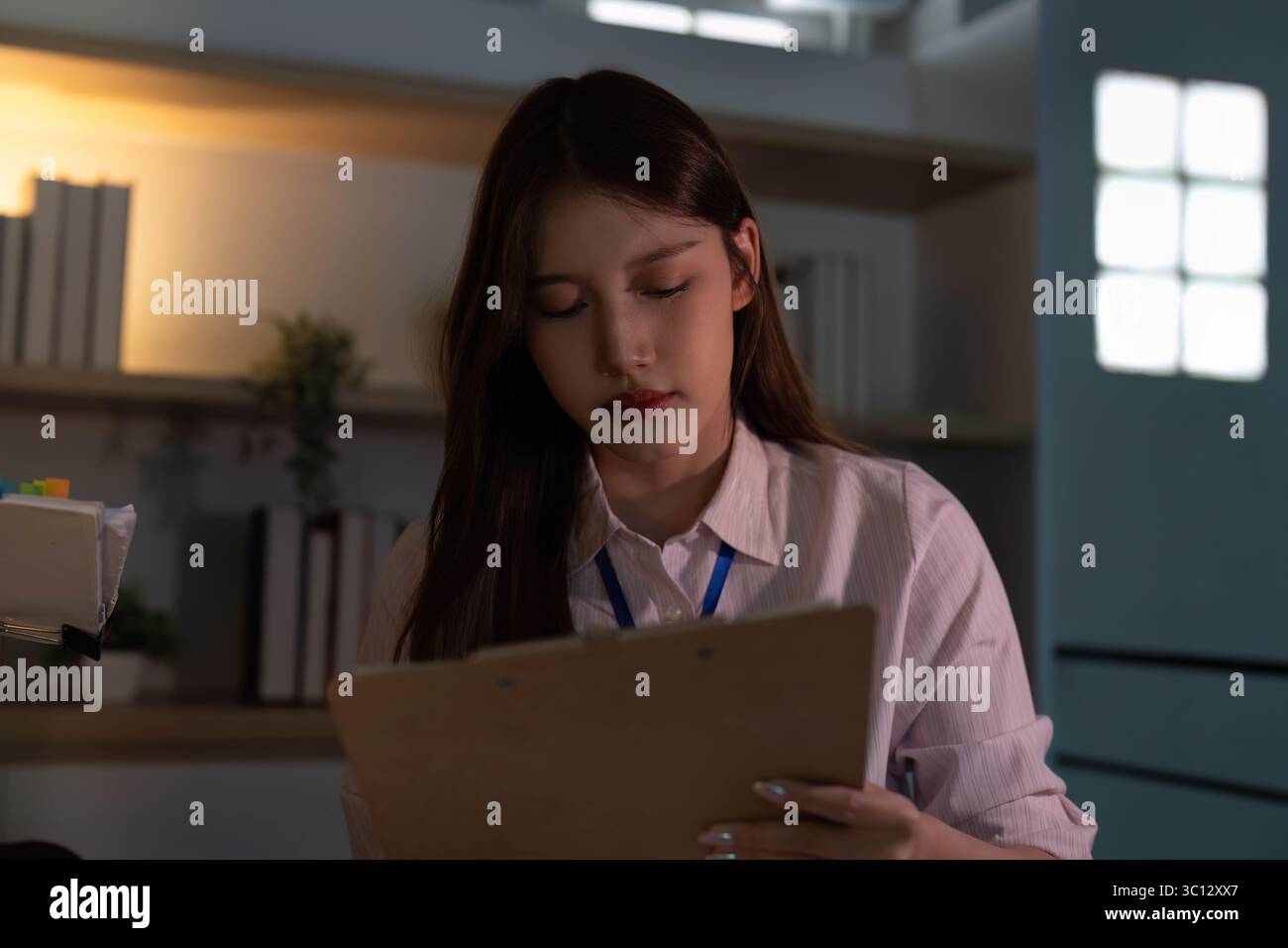 Young professionals collaborating in a modern office environment Stock Photo