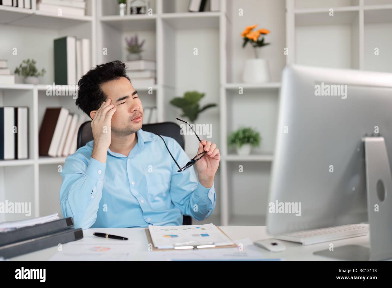 Stressed Office Worker with Headache Taking a Break from Computer ...