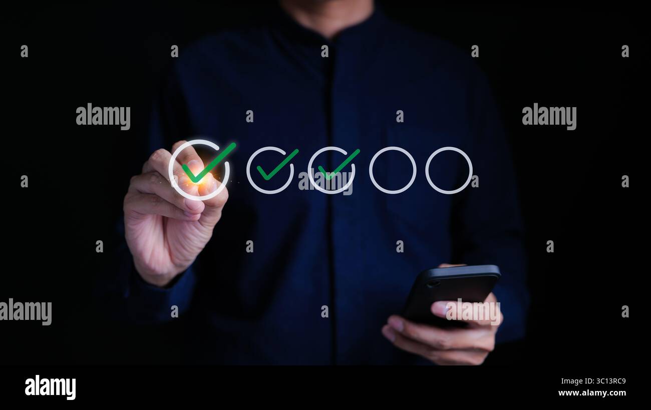 Businessman evaluating with checkboxes online on virtual screen. assessment survey online, choose correct answer in test, questions test, online exam, Stock Photo