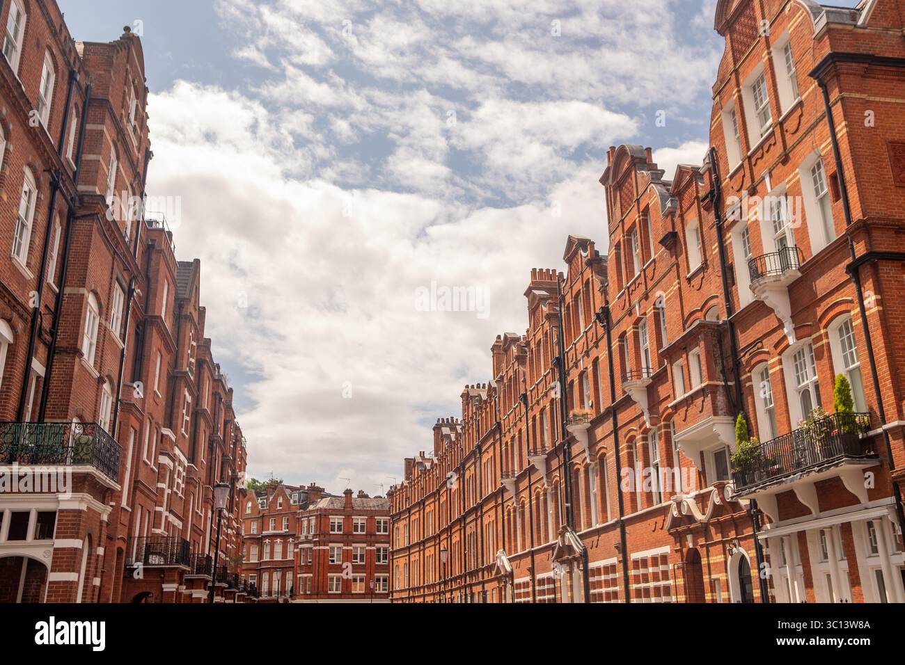 LONDON- JULY 15, 2025: Red brick mansion buildings in the prestigious neighbourhood around Egerton Gardens in South Kensington Knightsbridge area Stock Photo