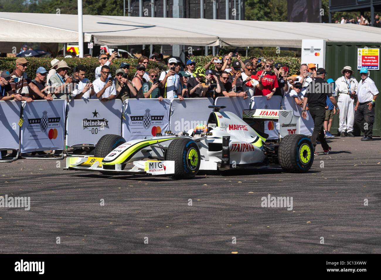 Brawn BGP 001 Formula 1 racing car in assembly area before driving up ...