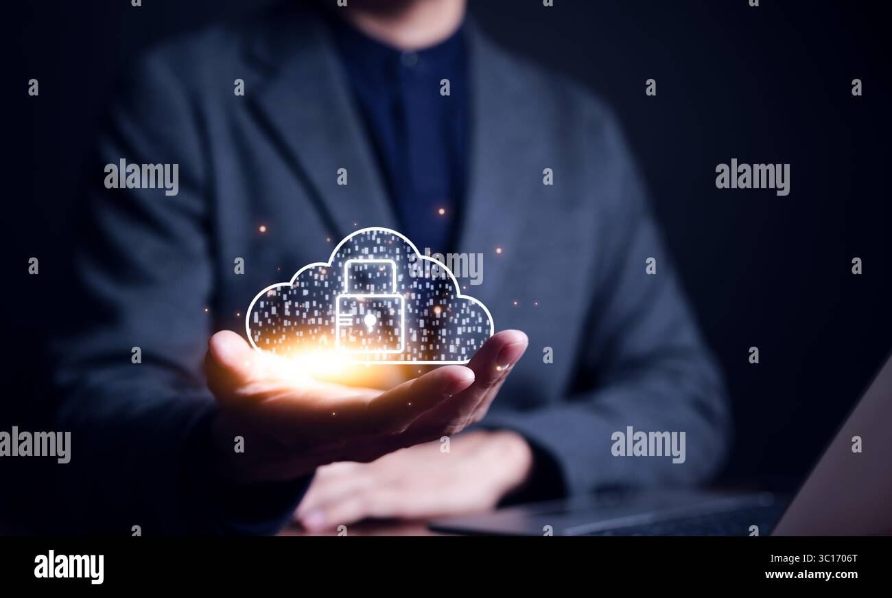 Cybersecurity Technology Concept. Businessman holding padlock and cloud icon. information security and encryption, User privacy security Stock Photo