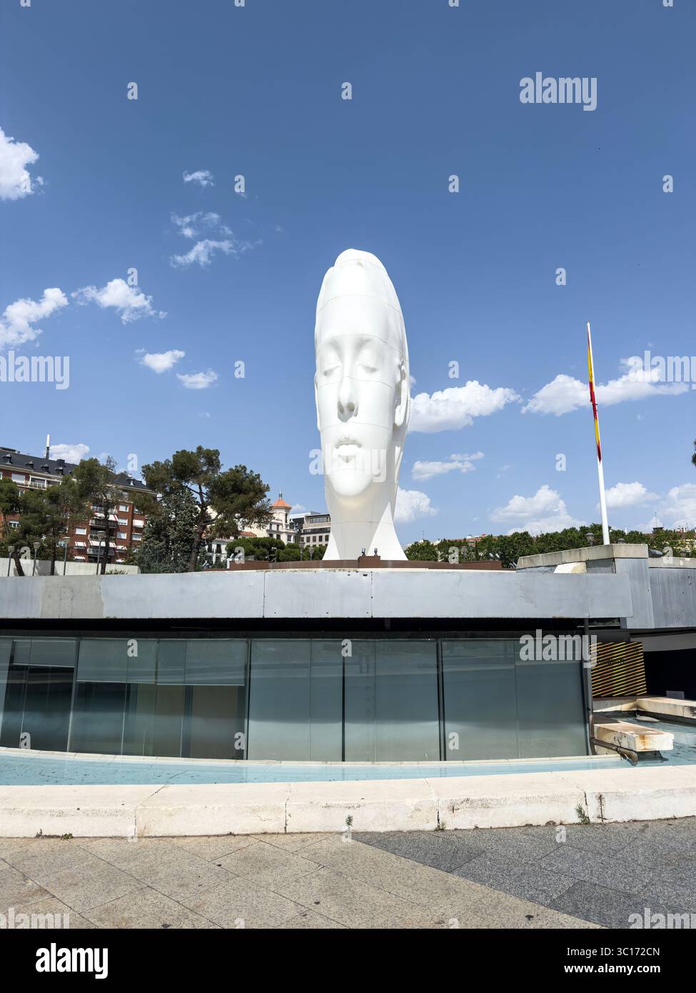 Julia, white marble sculpture by Jaume Plensa in Plaza Colon, Madrid, Spain - Smartphone Captured Stock Image
