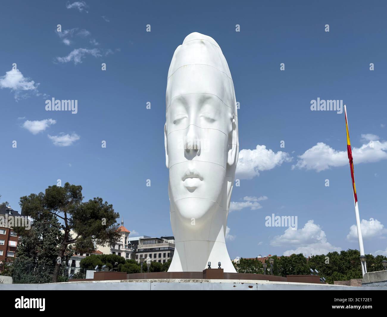 Julia, white marble sculpture by Jaume Plensa in Plaza Colon, Madrid, Spain - Smartphone Captured Stock Image
