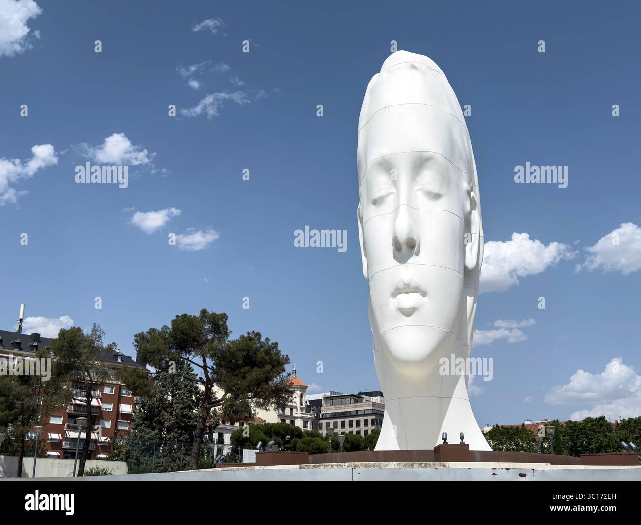Julia, white marble sculpture by Jaume Plensa in Plaza Colon, Madrid, Spain - Smartphone Captured Stock Image