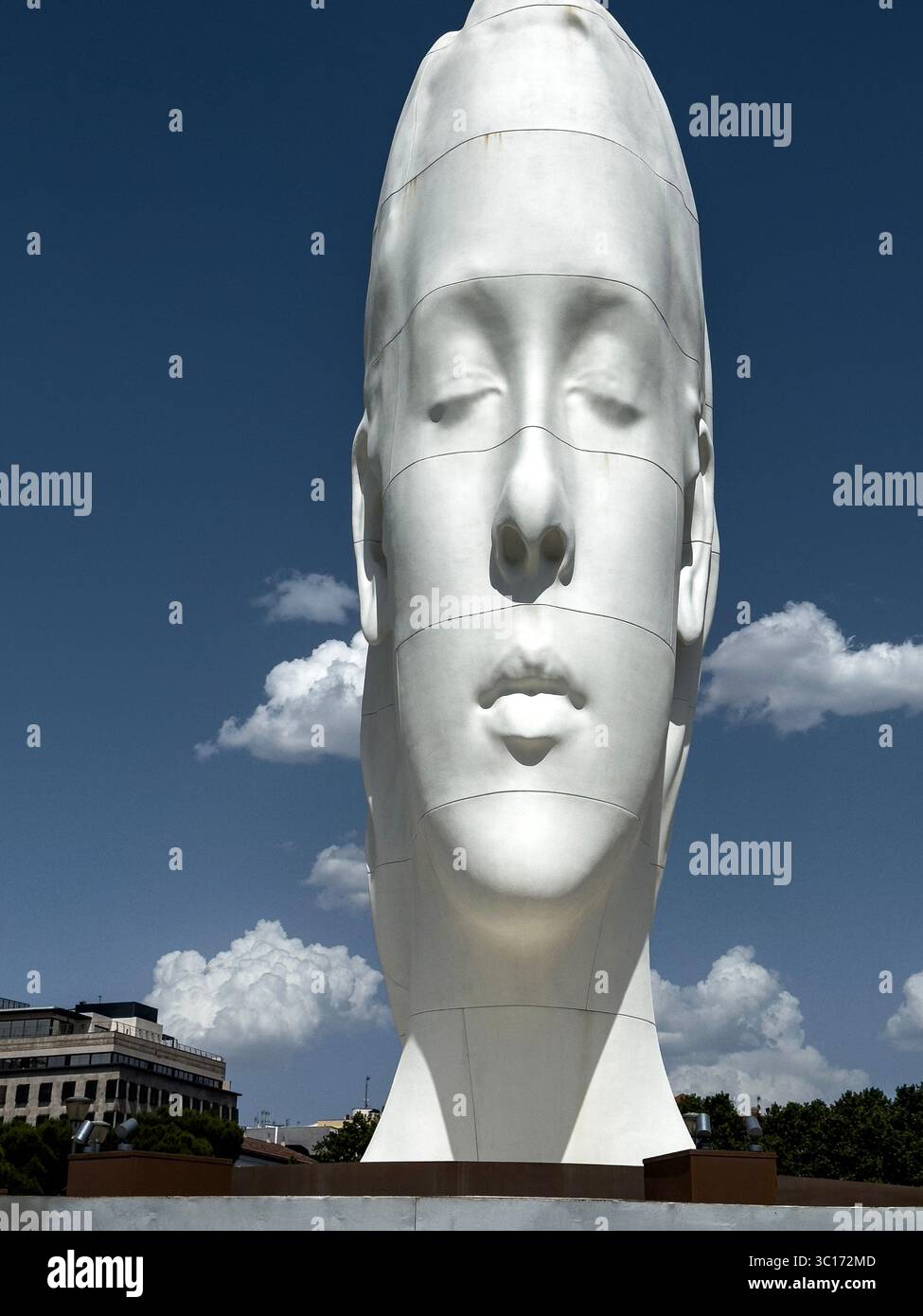 Julia, white marble sculpture by Jaume Plensa in Plaza Colon, Madrid, Spain - Smartphone Captured Stock Image