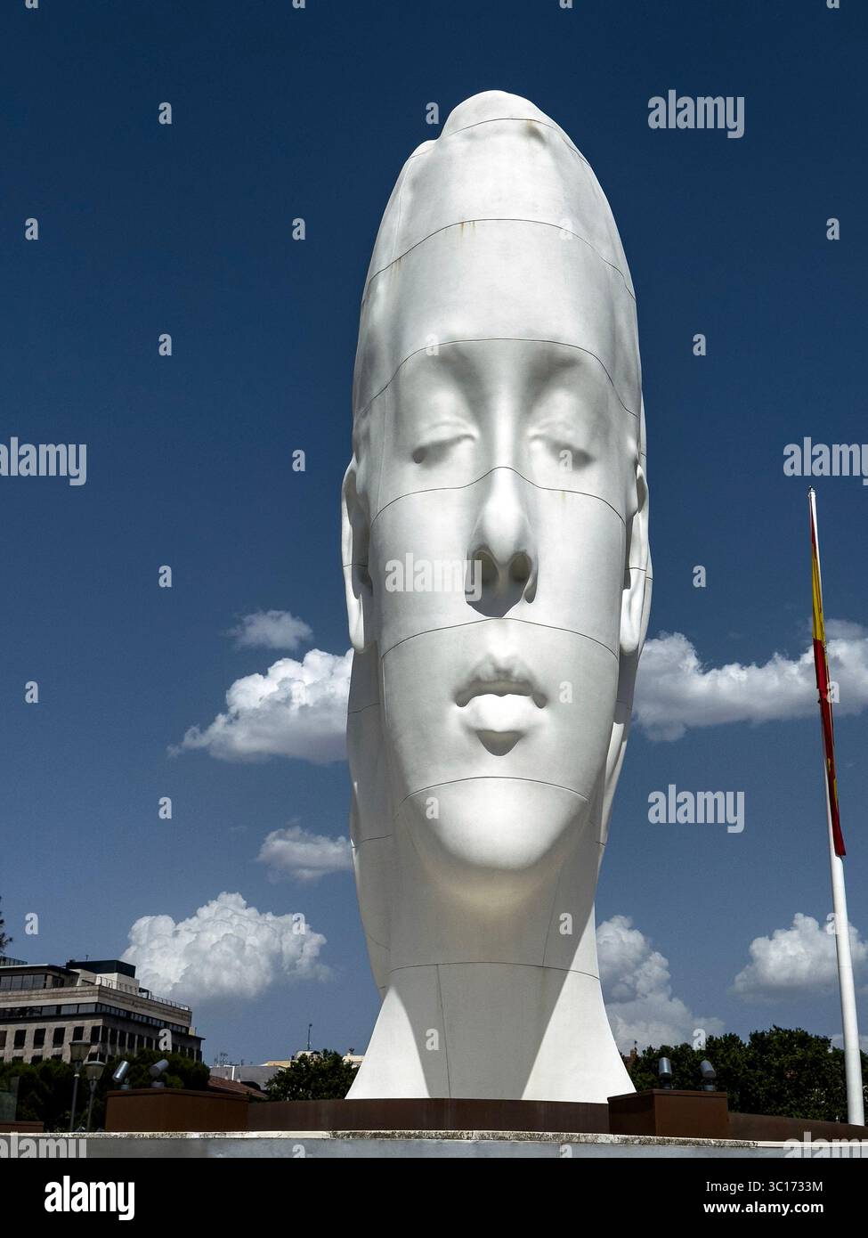 Julia, white marble sculpture by Jaume Plensa in Plaza Colon, Madrid, Spain - Smartphone Captured Stock Image