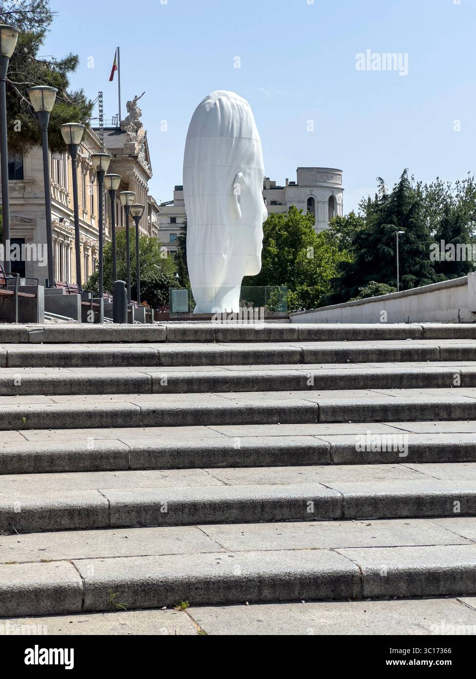 Julia, white marble sculpture by Jaume Plensa in Plaza Colon, Madrid, Spain - Smartphone Captured Stock Image