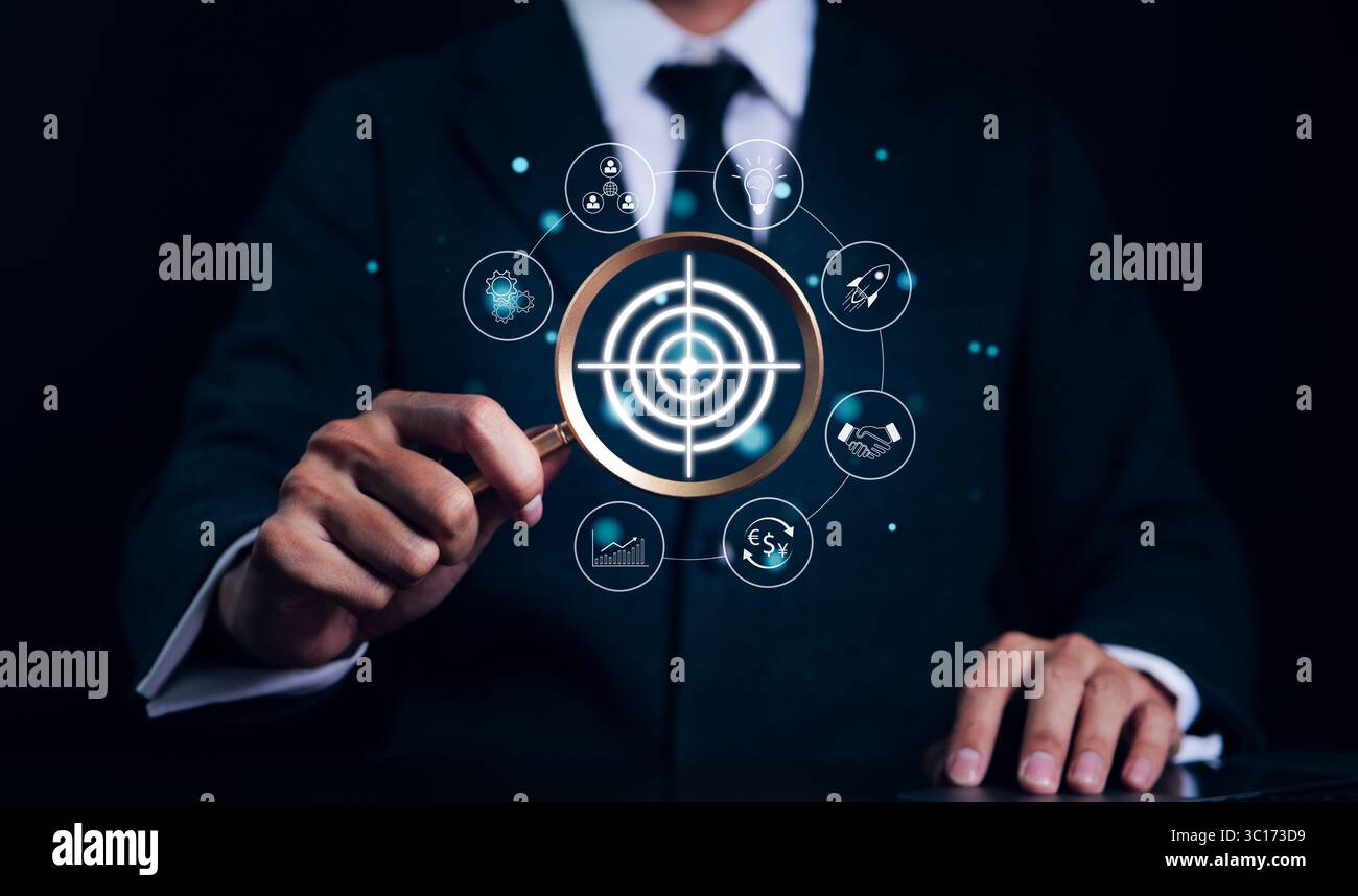 Targeting business and investment concept. Businessman holding a ...