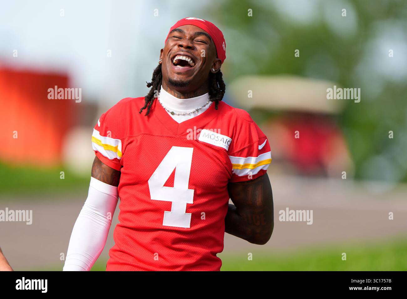 Kansas City Chiefs wide receiver Rashee Rice laughs with a teammate as ...