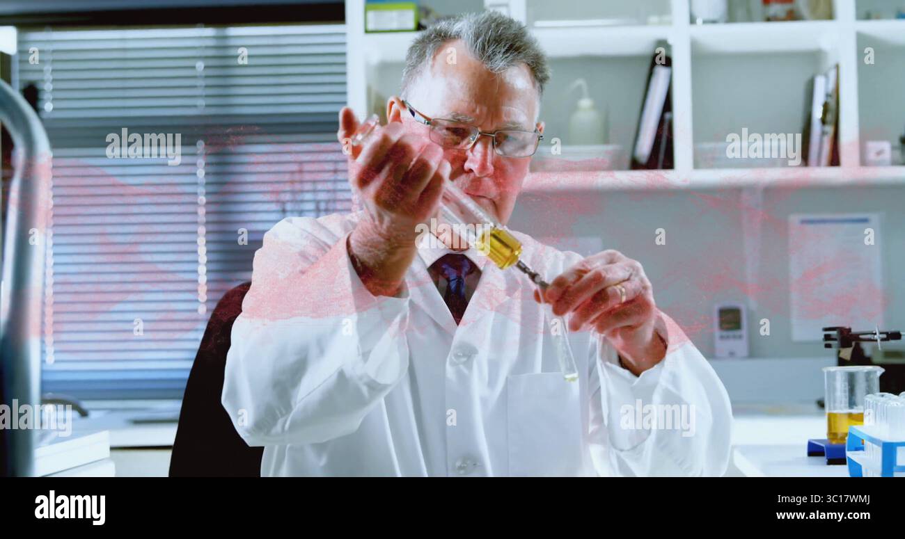 Dispensing senior scientist wearing lab coat in lab, holding pipette ...