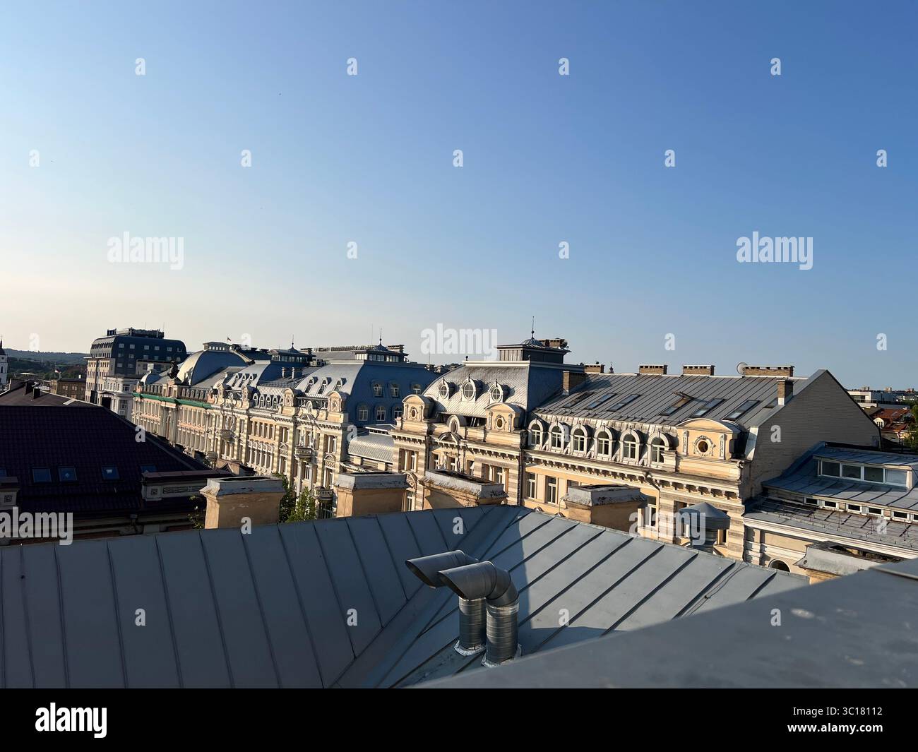 Rooftop view of Vilnius, Lithuania, on a bright summer day.Taken from Neringa Hotel highlighting historic European architecture and blue Baltic sky - Smartphone Captured Stock Image