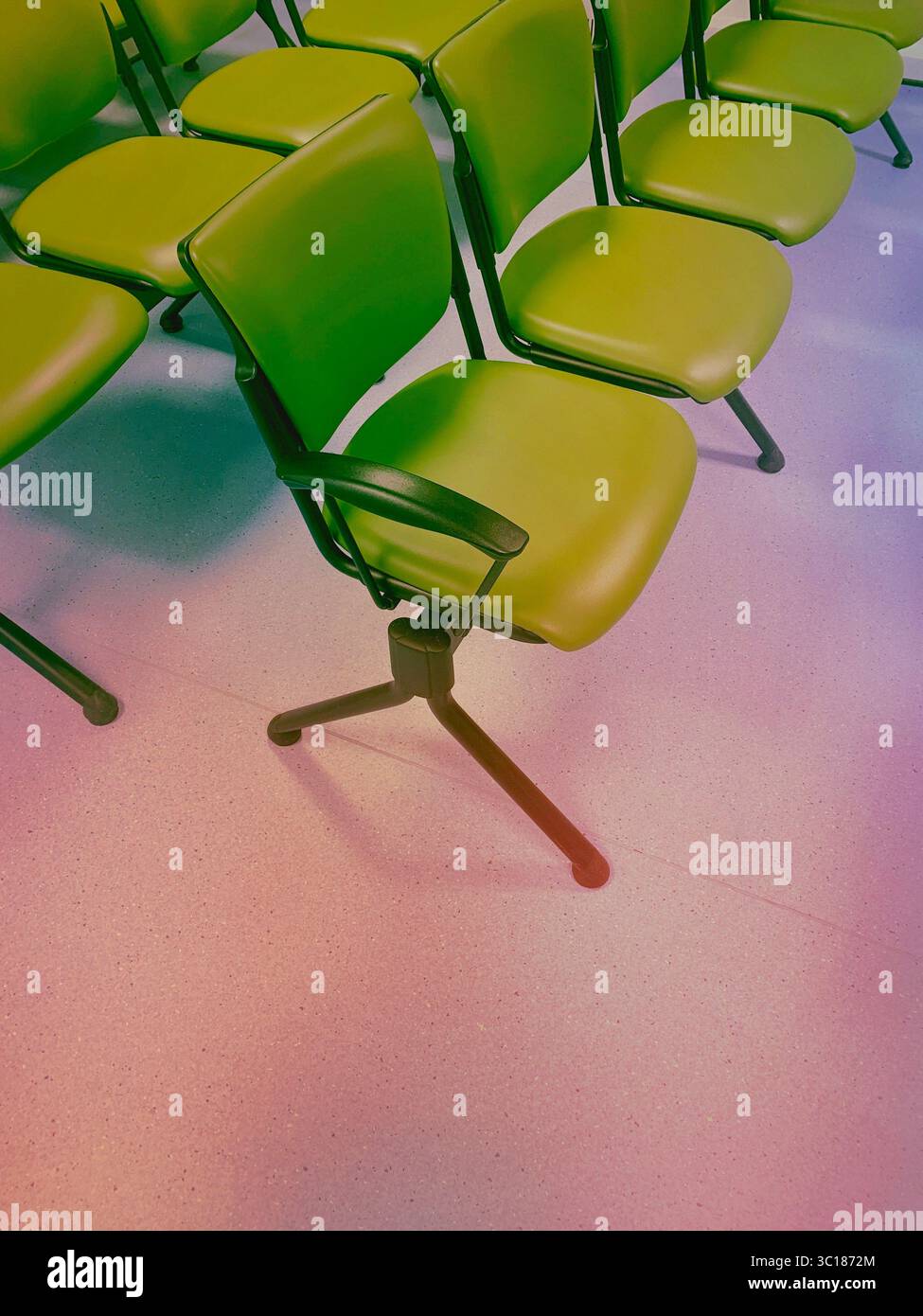 Empty rows of green waiting room seats - chairs wait office chair row Stock Photo