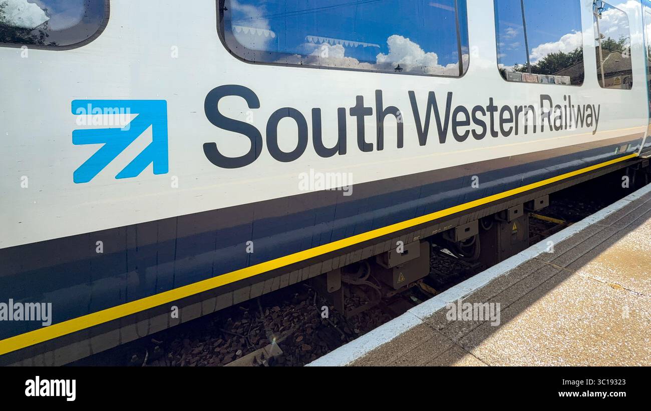Alton, Hampshire, England, UK - 20 July 2025: Side view of a Class 450 train at Alton railway station. The train is operated by South Western Railway - Smartphone Captured Stock Image