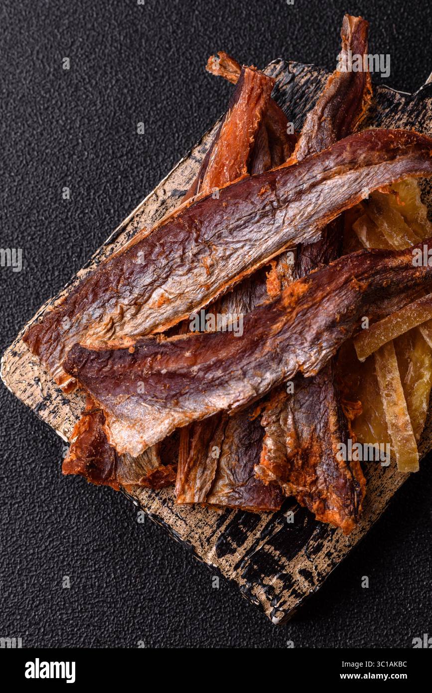 Dried salted fish as snacks or jerky, seafood as slices. Dried seafood ...