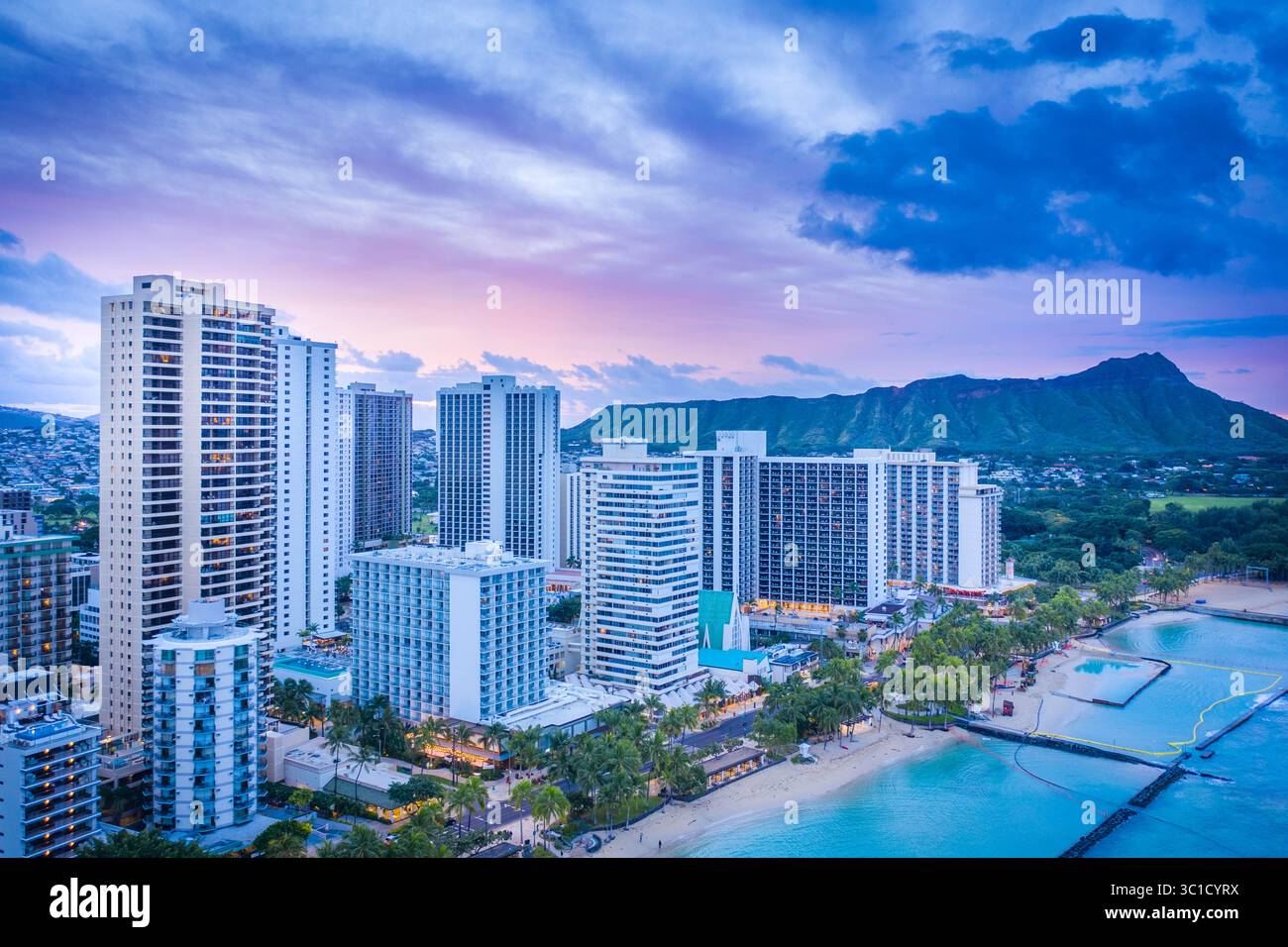 Aerial view of Waikiki Beach and Diamond Head at dusk, Honolulu, Oahu ...