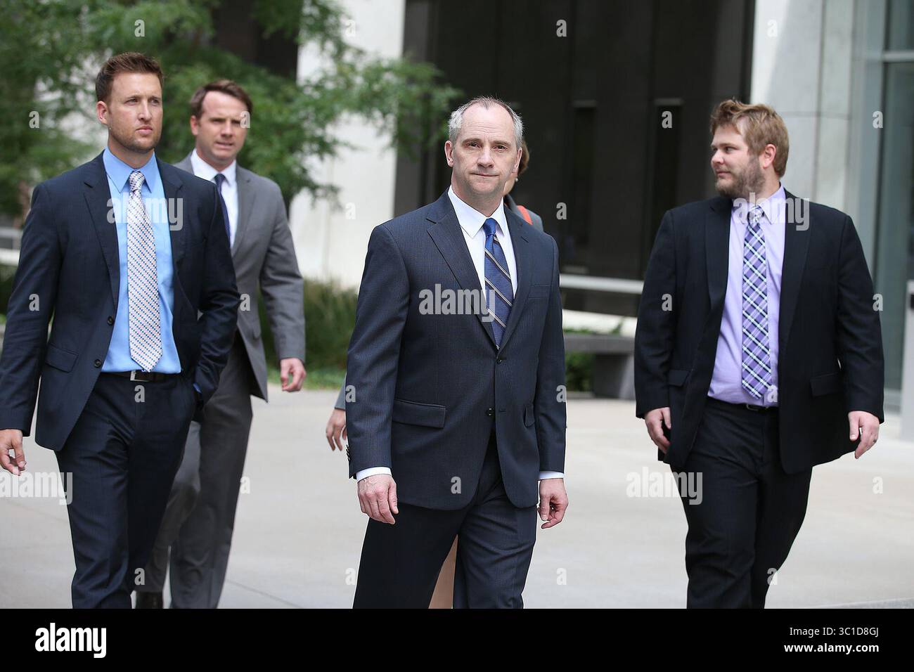 July 29, 2014 - St. Paul, MN, U.S. - Jesse Ventura's lawyers including David Olsen, center, made their way out of the Warren E. Burger Federal Building to address the media after a verdict was reached, Tuesday, July 29, 2014 in St. Paul, MN. (/STAR TRIBUNE) (Credit Image: Elizabeth Flores/Minneapolis Star Tribune/TNS via ZUMA Wire) Stock Photo