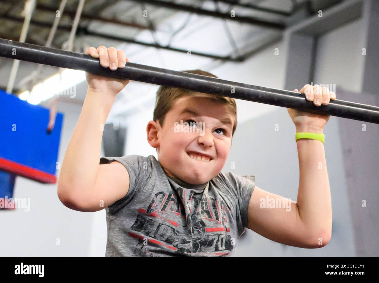 November 21, 2017 - Edina, Minnesota, USA - Billy Smith tried with all his might to do one more pull up. Tuesday, November 21, 2017 ..If you want your kid to drop the video game controller and get off the couch, you can take your pick of gyms and clubs and teams in the Twin Cities in sports ranging from fencing to figure skating to rowing...Add being a ninja warrior...In the last two or three years, at least six gyms have sprung up in the metro area offering to train people to be ninja warriors just like on the obstacle course contest NBC television show, ''American Ninja Warriors.'' At least Stock Photo