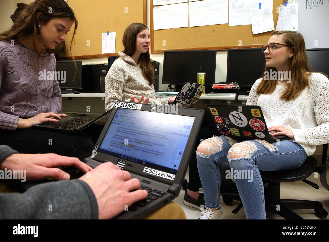 February 6, 2019 - Elmhurst, IL, USA - York H.S. journalism students from, left, Grace Moriarty, Cece Lampa, and Holly Kauck, research and discuss ideas at York H.S. in Elmhurst, Ill., Wednesday, Feb. 6, 2019, as they participate in a national project to mark the anniversary of the Parkland shooting, in which they write obituaries for children who have died in the past year due to gun violence. (Credit Image: © Antonio Perez/Chicago Tribune/TNS via ZUMA Wire) Stock Photo