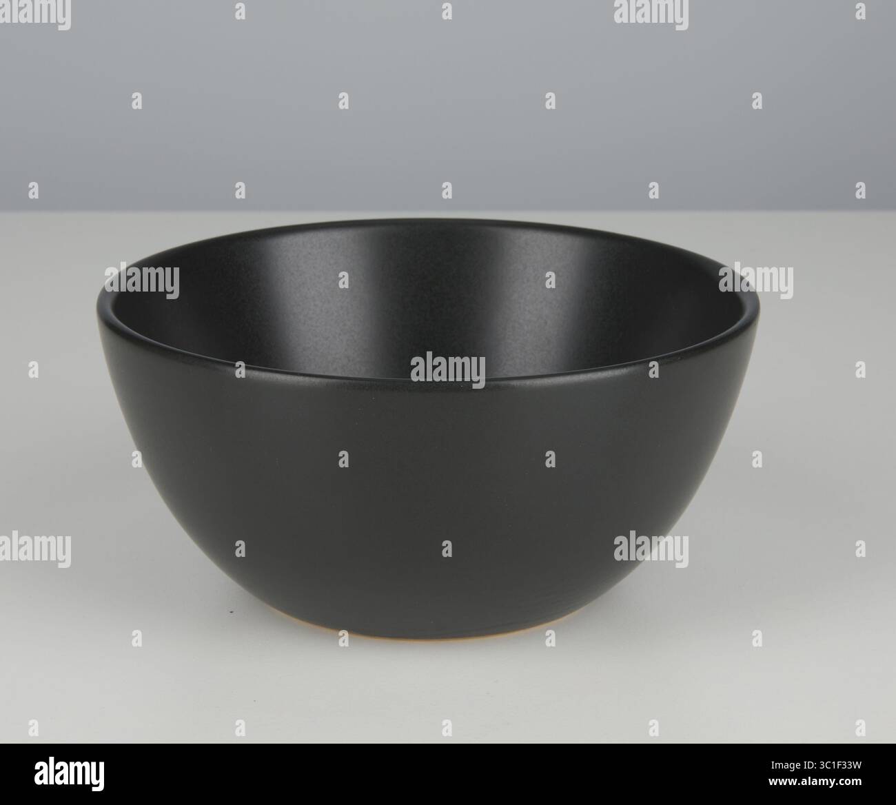 Matte black ceramic cup isolated nature background with clipping path Stock Photo