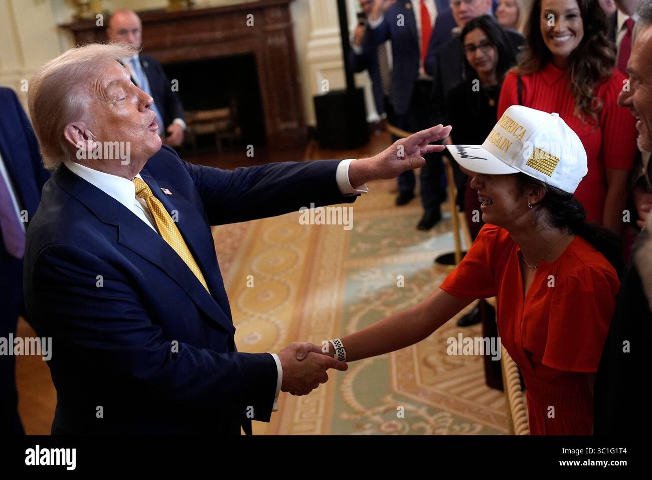 US President Donald Trump greets guests at a reception with Republican ...