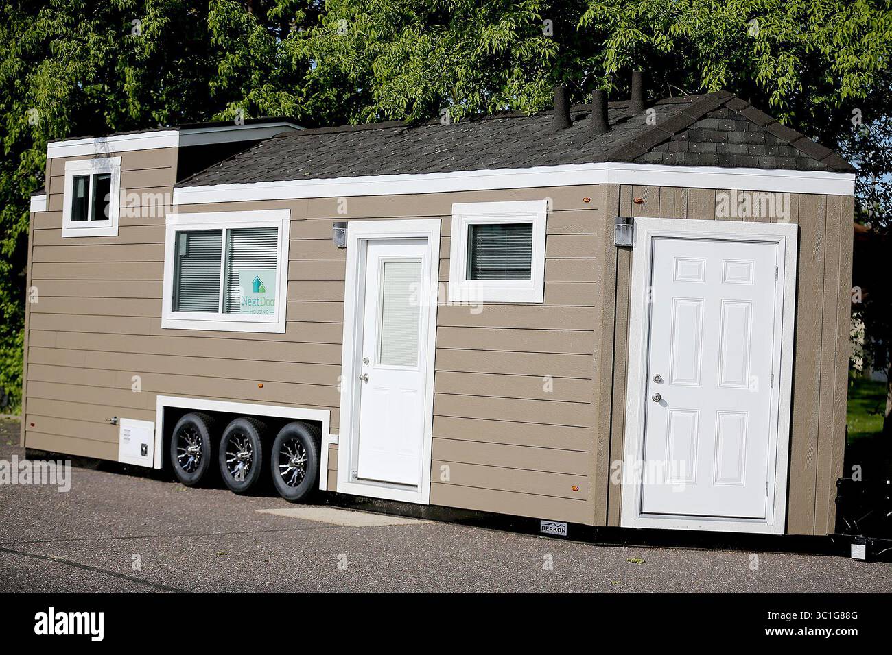 May 17, 2016 - New Brighton, MN, U.S. - John Louiselle, left, and Jesse Lammi are a pair of young New Brighton entrepreneurs that have started NextDoor Housing, a company that produces tiny houses with a twist. The handicapped-accessible houses are really more like trailers and aimed at adults recovering from an illness or who are disabled. The two helped draft a bill changing zoning laws so the houses would be welcome more places, regardless of zoning laws. It passed last week. (/STAR TRIBUNE) (Credit Image: Elizabeth Flores/Minneapolis Star Tribune/TNS via ZUMA Wire) Stock Photo