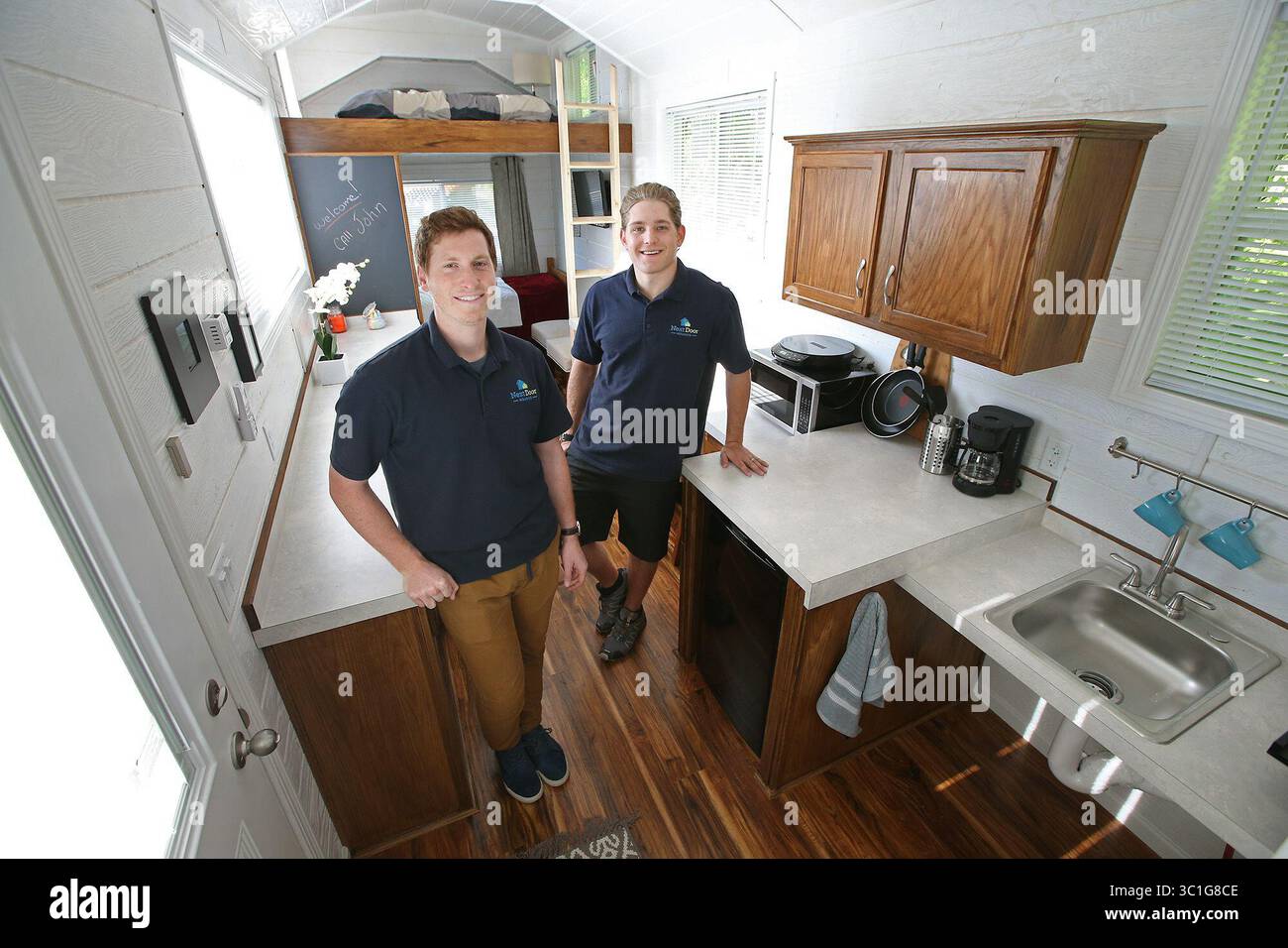 May 17, 2016 - New Brighton, MN, U.S. - John Louiselle, left, and Jesse Lammi are a pair of young New Brighton entrepreneurs that have started NextDoor Housing, a company that produces tiny houses with a twist. The handicapped-accessible houses are really more like trailers and aimed at adults recovering from an illness or who are disabled. The two helped draft a bill changing zoning laws so the houses would be welcome more places, regardless of zoning laws. It passed last week. (/STAR TRIBUNE) (Credit Image: Elizabeth Flores/Minneapolis Star Tribune/TNS via ZUMA Wire) Stock Photo