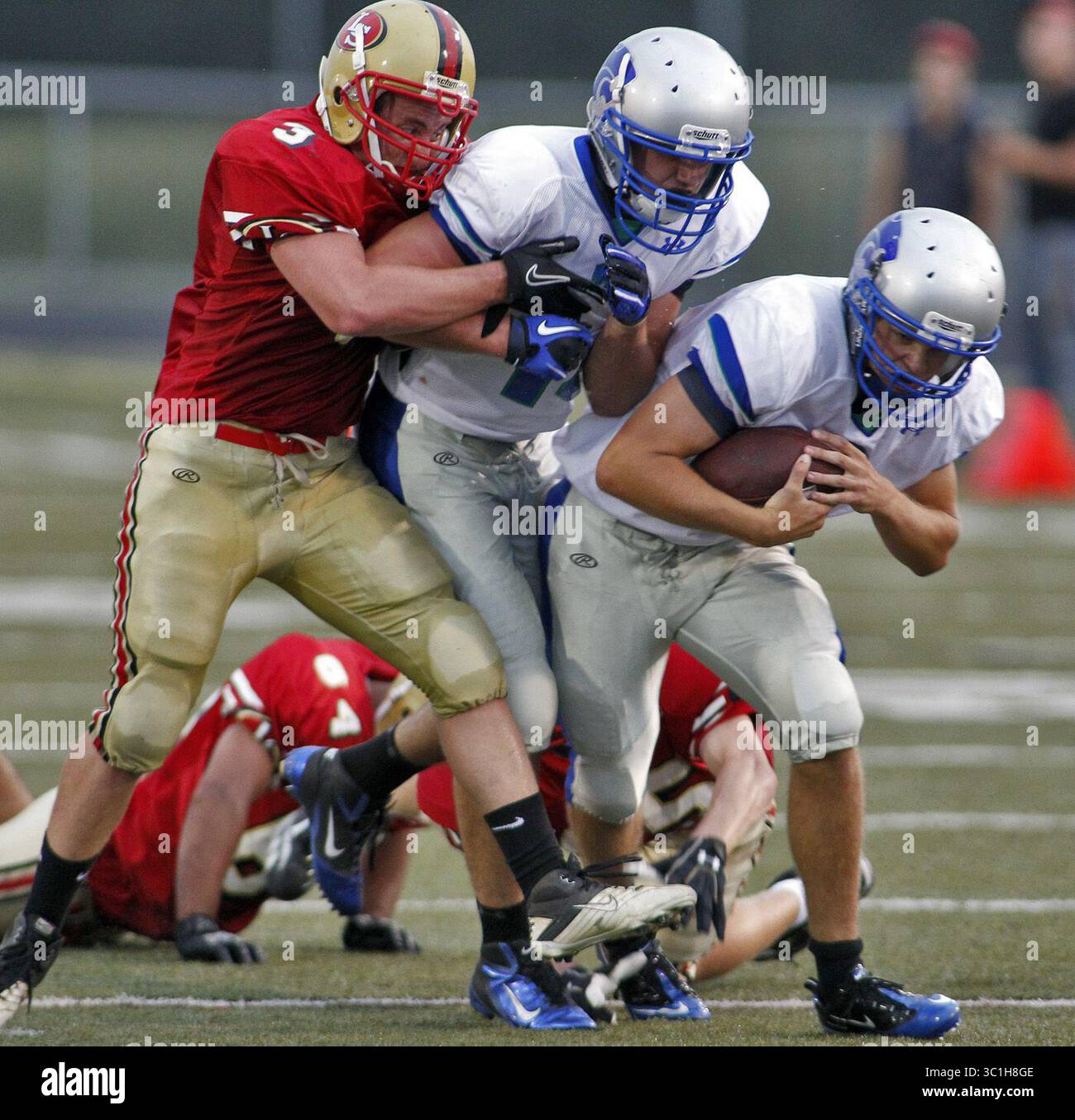 Sept. 2, 2011 - Lakeville, Minnesota, U.S. - Prep football - Lakeville South vs. Eagan. Eagan quarterback Drew Bauer, right got a little help from a teammate as he drove the ball up field in first half action..(/STARTRIBUNE ) (All players names -program) ( (Credit Image: Marlin Levison/Minneapolis Star Tribune/TNS via ZUMA Wire) Stock Photo