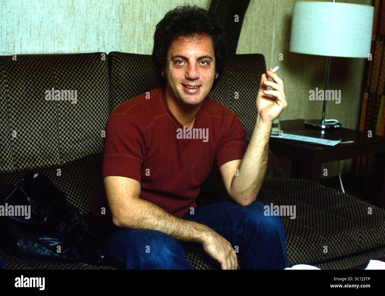 May 22, 2010 - American musician BILLY JOEL sits on a couch and smokes a  cigarette. Date and place unknown. (Credit Image: © Barry Schultz/ZUMA Wire  Stock Photo