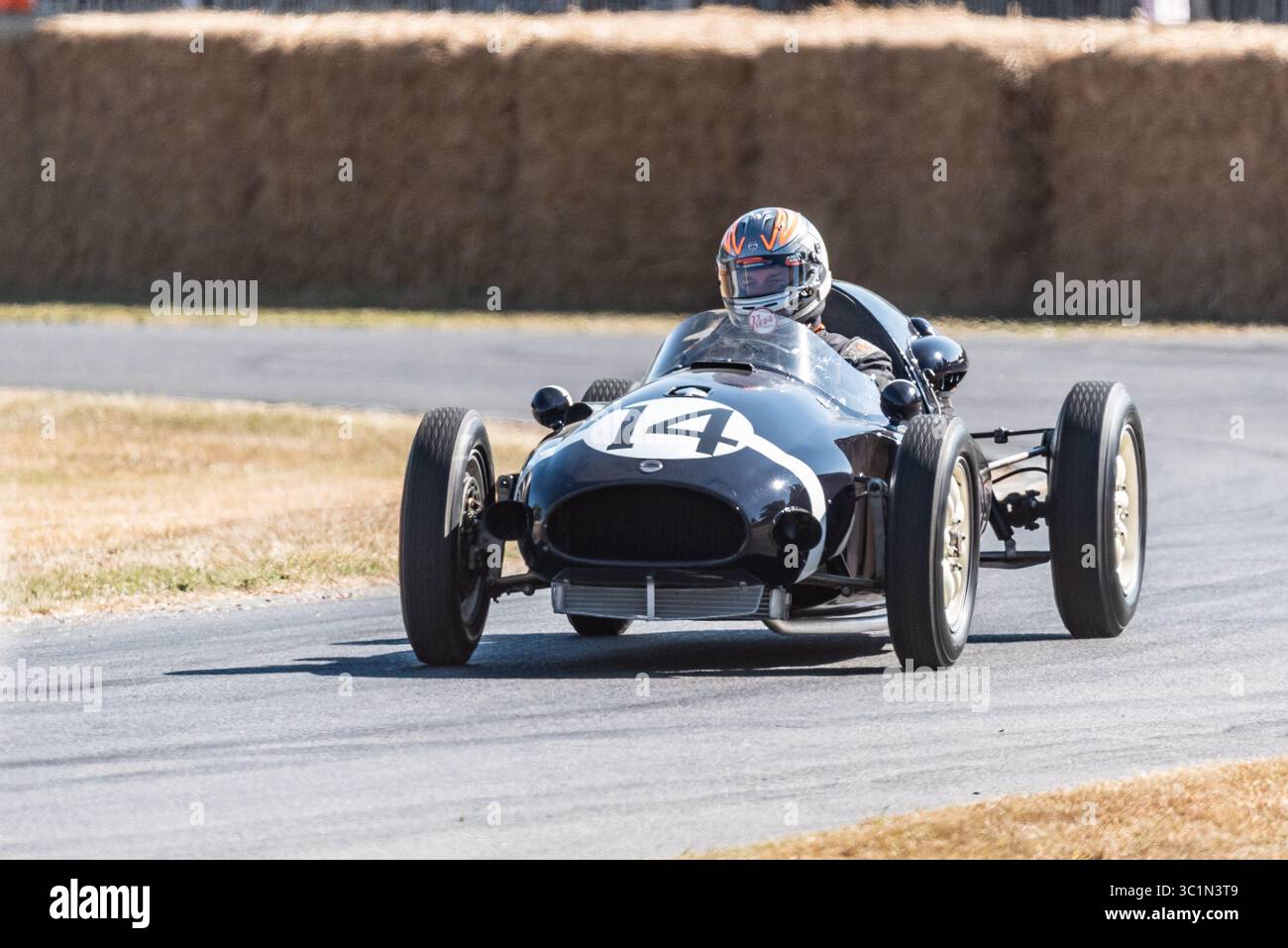 Cooper T43 historic Formula 1 racing car driving up the hillclimb at ...