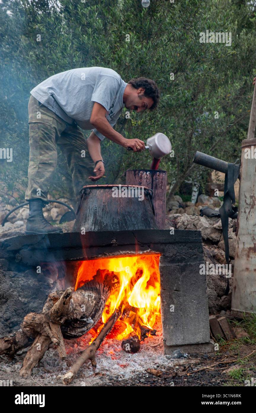 Traditional way of distilling raki in Crete Stock Photo - Alamy