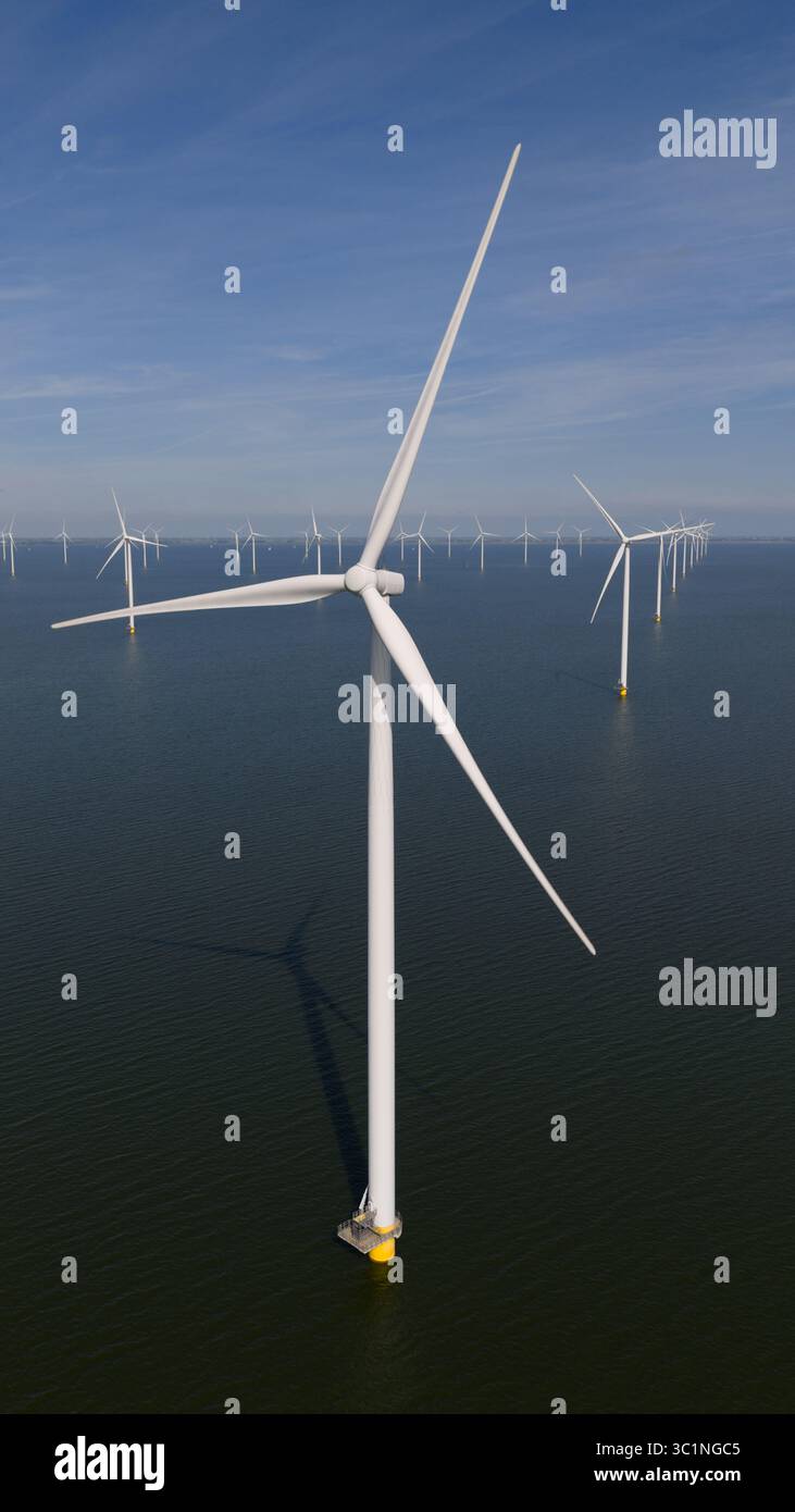 Offshore Rotor Sign Offshore wind turbine fixed foundation, rotor, blades. Aerial drone ...
