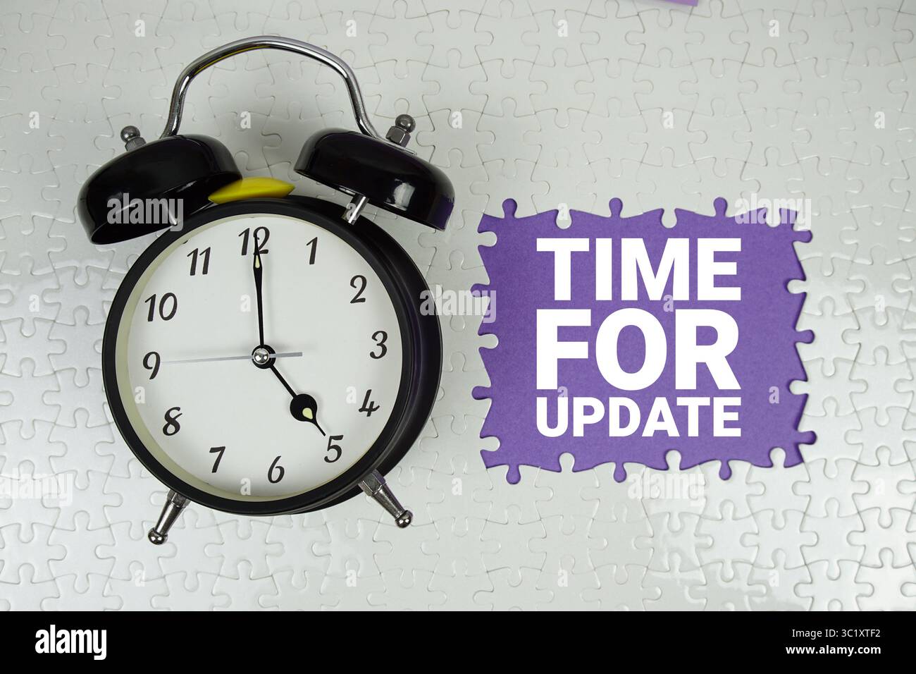 Time for Update text with alarm clock on purple background Stock Photo