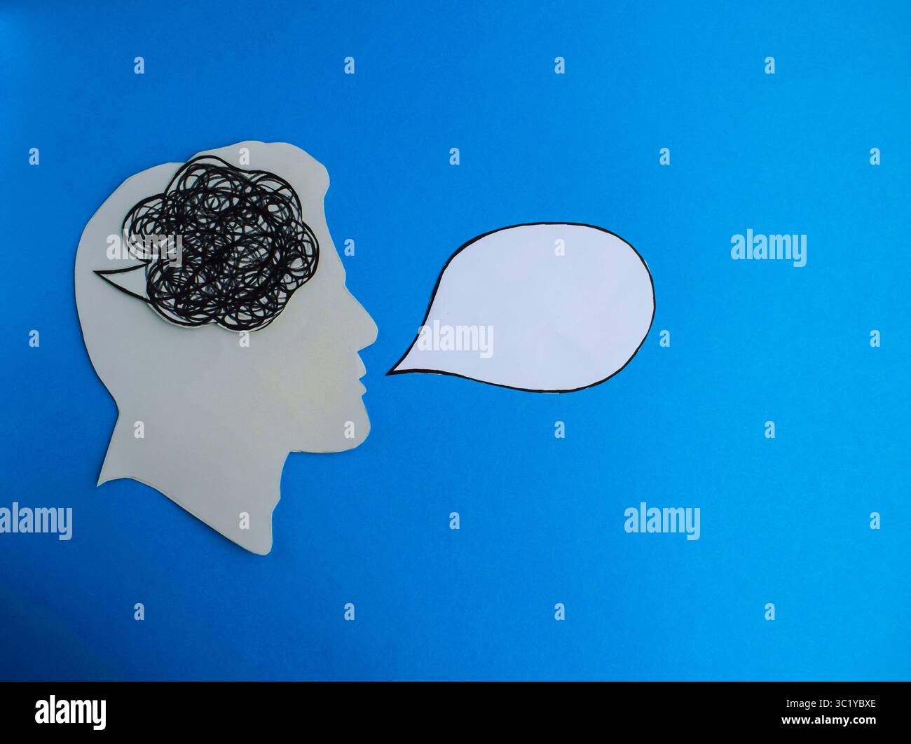 Tangled Thoughts and Blank Speech Bubble on Blue Background Stock Photo