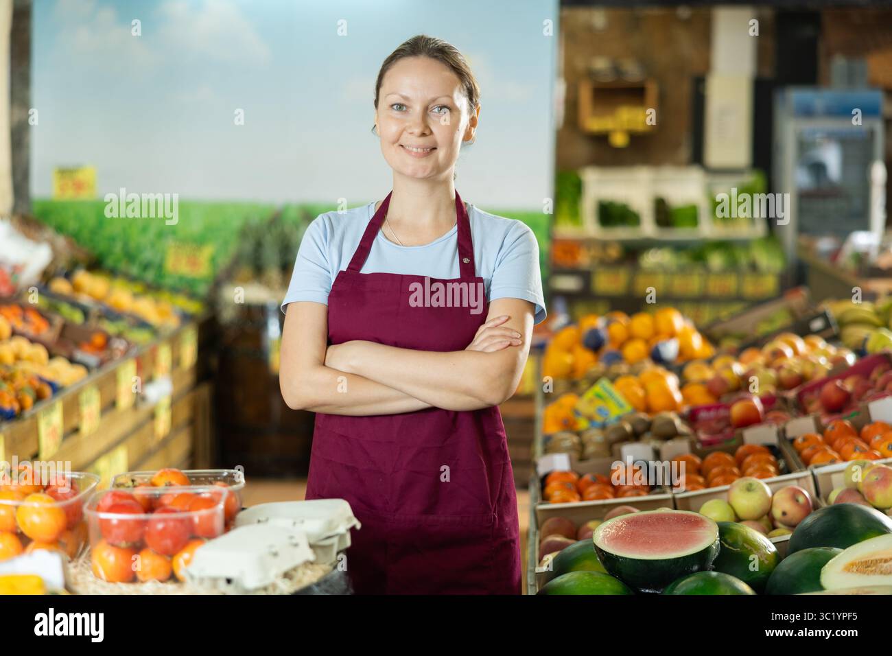 Fruit vendor waits customers market hi-res stock photography and